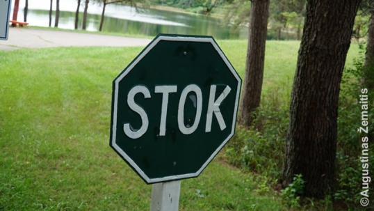 A STOP sign translated into Lithuanian as STOK and repaited in green, the traditional color of Lithuania