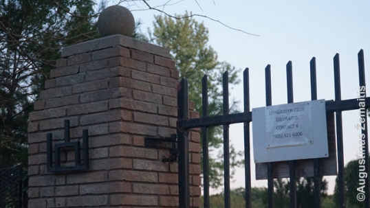Giedraitis club gate with the Columns of Gediminas symbol