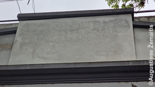 Still-visible name of Neptūnas on the building